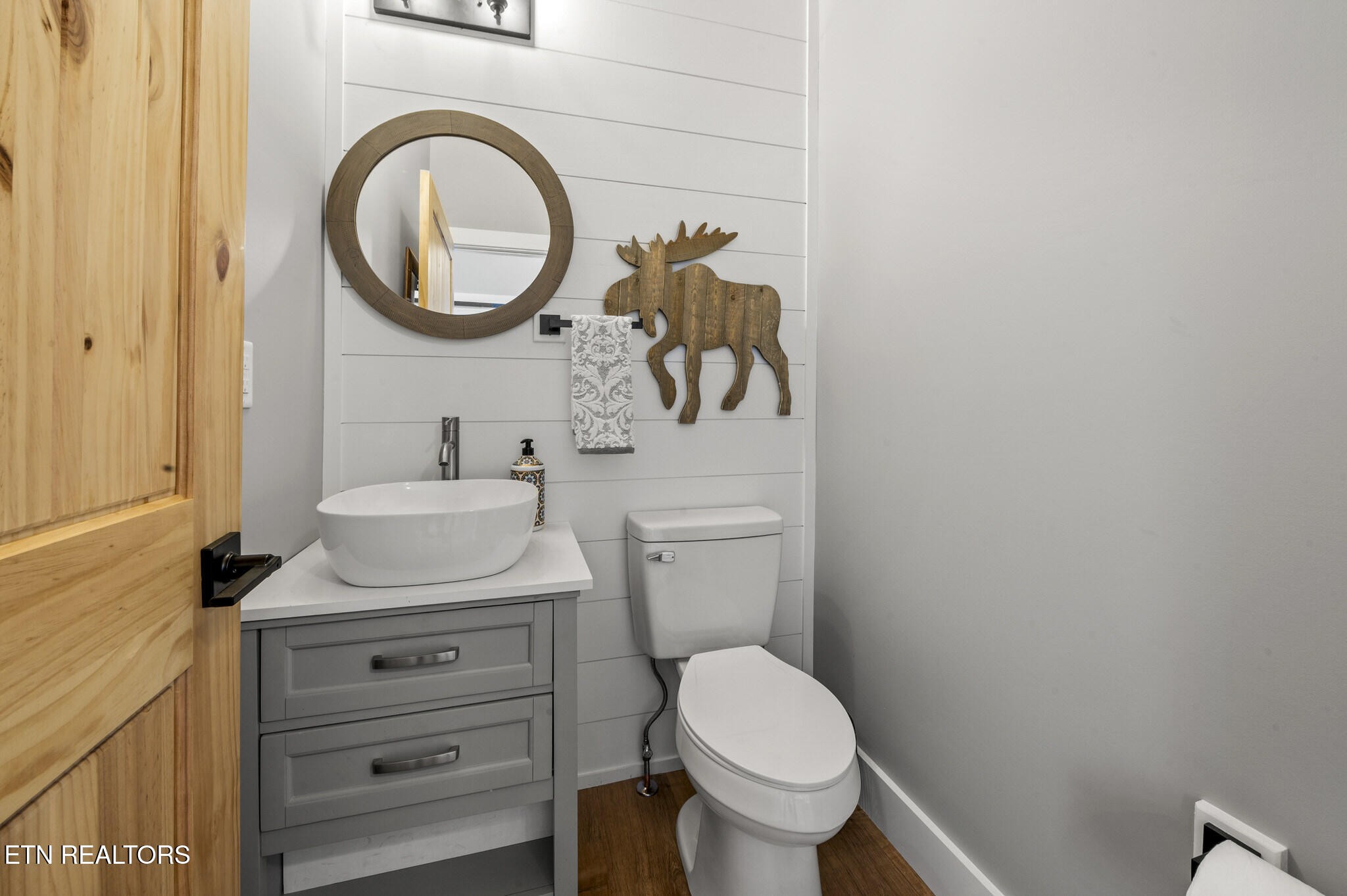 688 Shell Mountain Road Sevierville, TN 37876 - Photo 13 of 43 a bathroom with a sink a toilet and a mirror