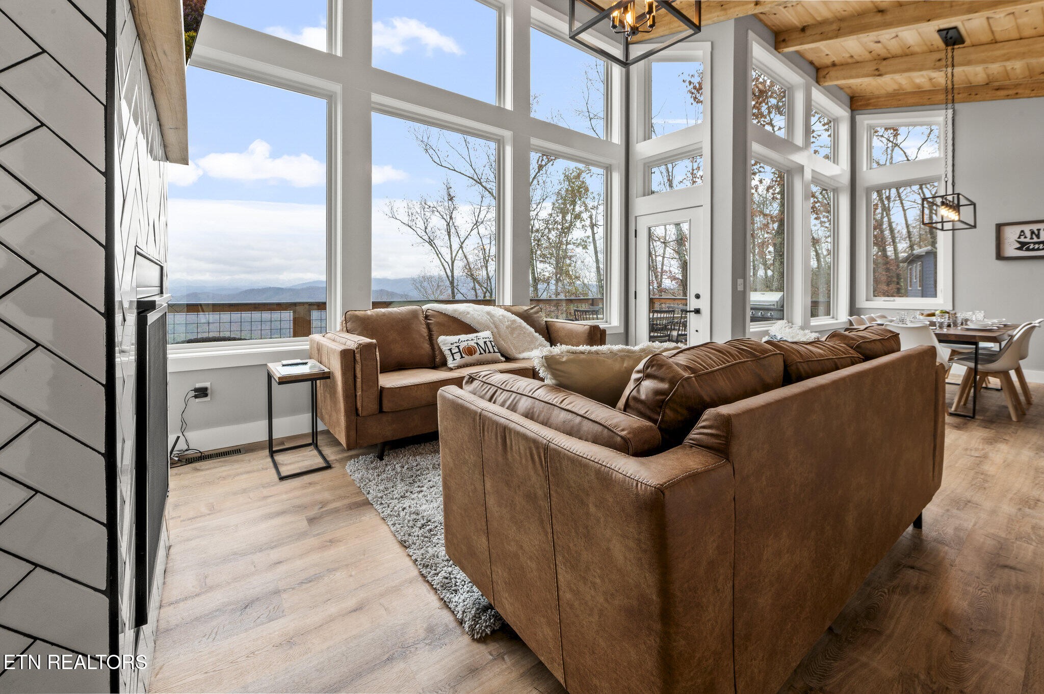 688 Shell Mountain Road Sevierville, TN 37876 - Photo 2 of 43 a living room with furniture and a large window