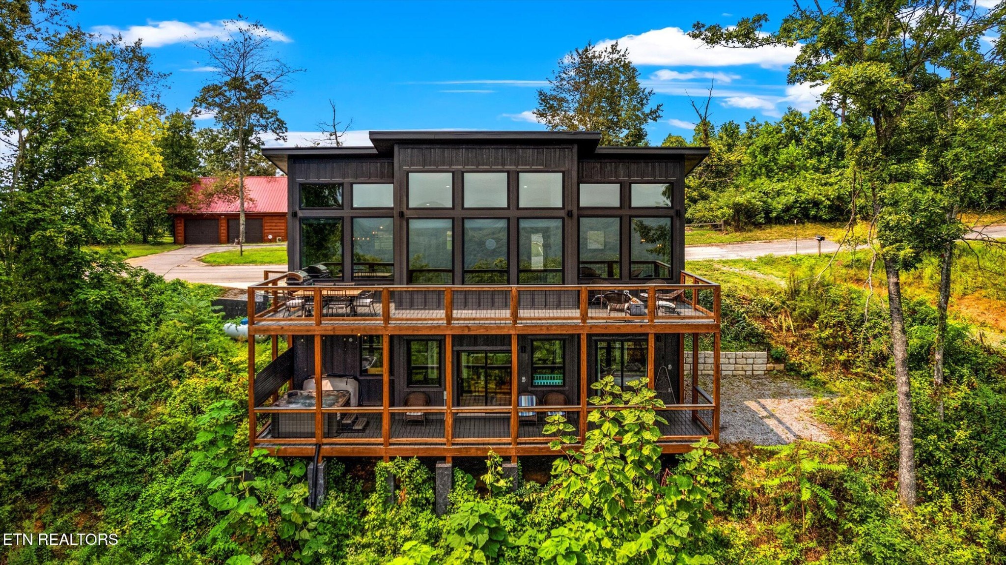 688 Shell Mountain Road Sevierville, TN 37876 - Photo 40 of 43 a front view of a house with a yard