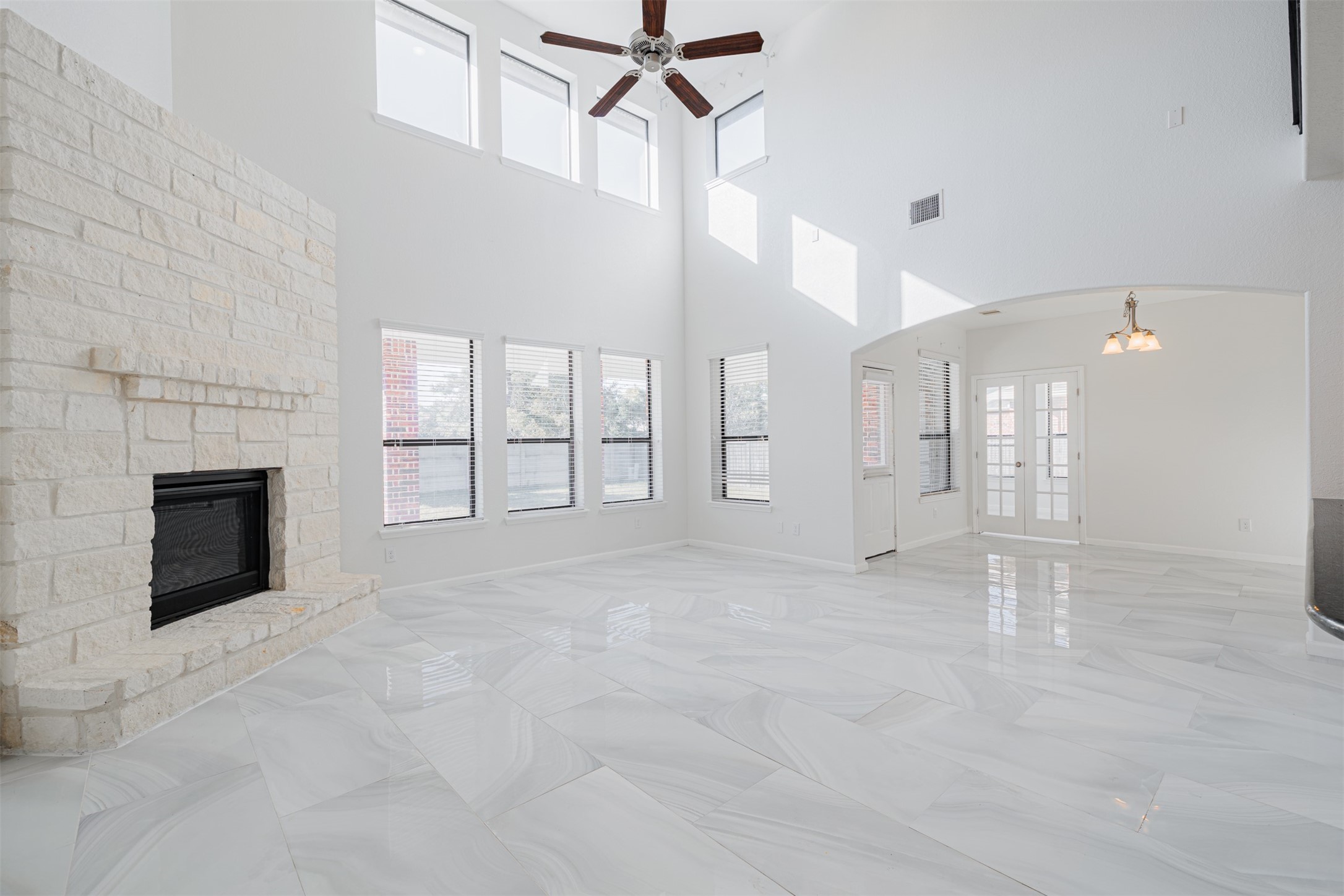 7814 Pacific Spring Lane Richmond, TX 77407 - Photo 13 of 32 a view of a livingroom with a fireplace and window
