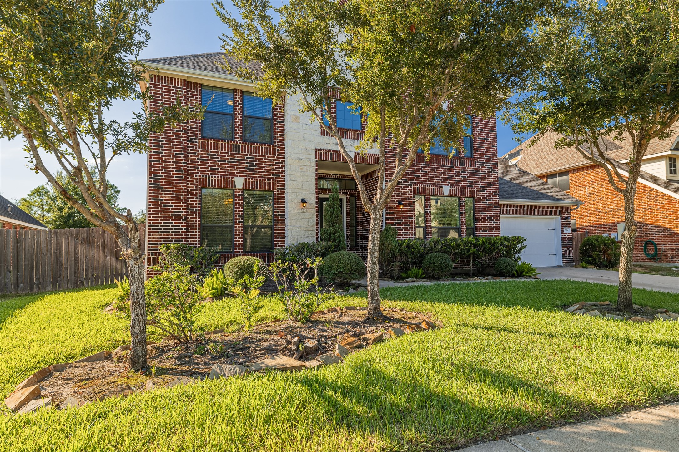 7814 Pacific Spring Lane Richmond, TX 77407 - Photo 2 of 32 a view of a house with backyard and sitting area