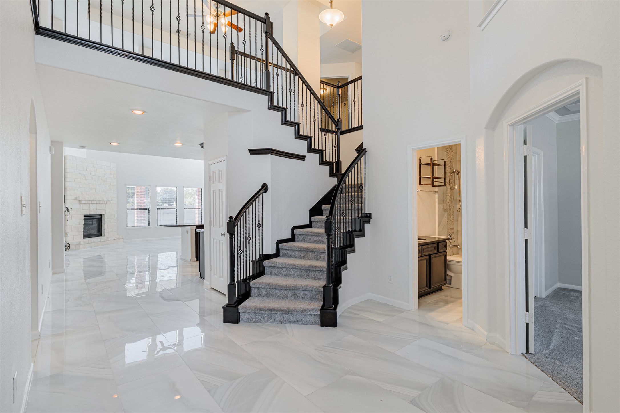 7814 Pacific Spring Lane Richmond, TX 77407 - Photo 5 of 32 a view of entryway and hall with a living room