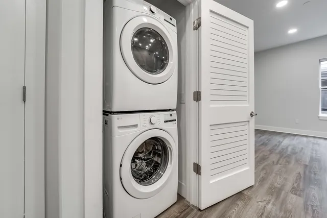 a view of a hallway with washer and dryer