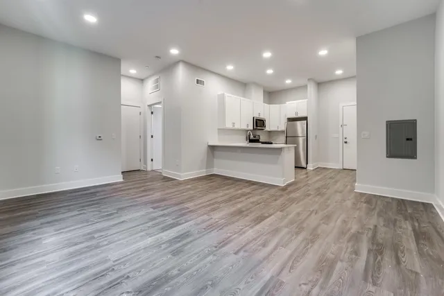a view of kitchen with wooden floor and window