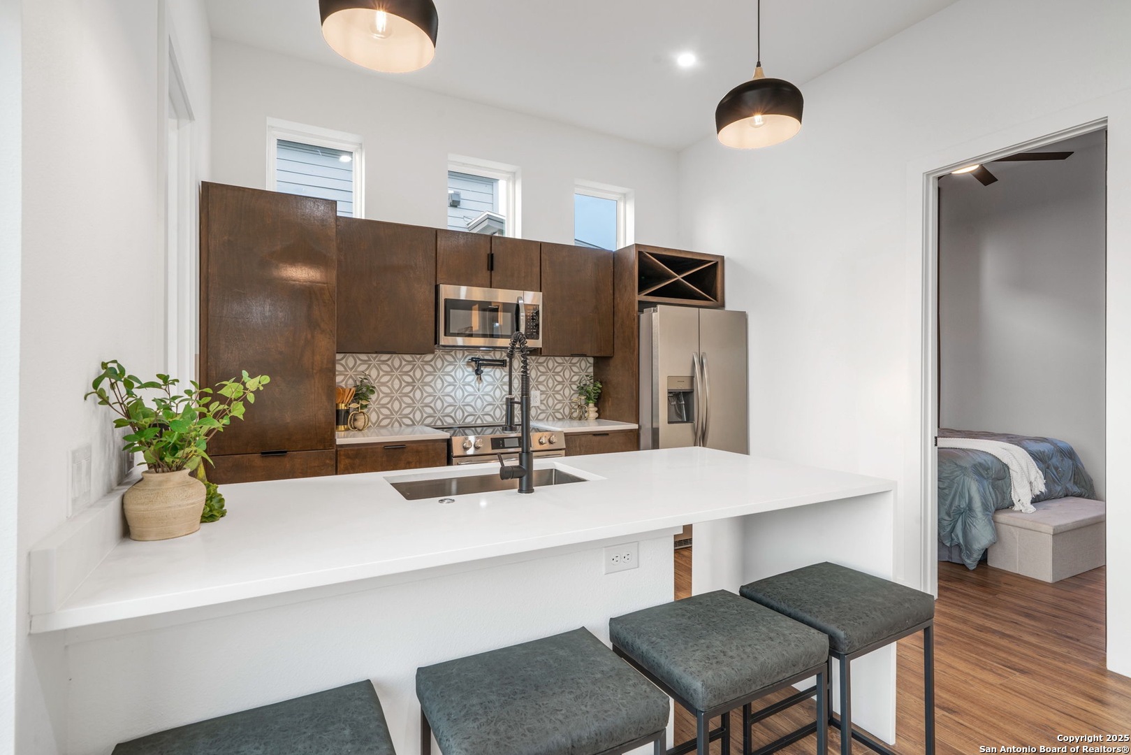 107 Harding Place, Unit 101 San Antonio, TX 78203 - Photo 15 of 39 a bathroom with a sink potted plant and a window