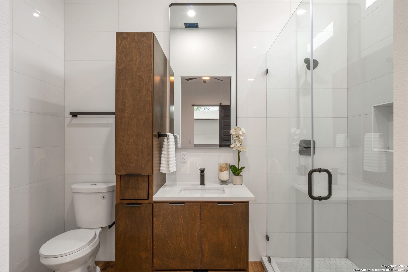 107 Harding Place, Unit 101 San Antonio, TX 78203 - Photo 21 of 39 a bathroom with a granite countertop sink toilet and shower