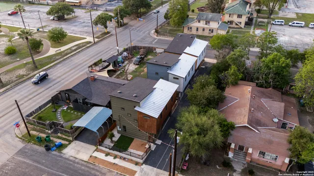 an aerial view of house with a yard