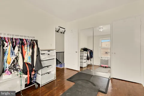 a room with gym equipment and a large window