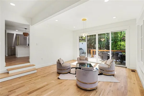 a living room with furniture and outdoor space
