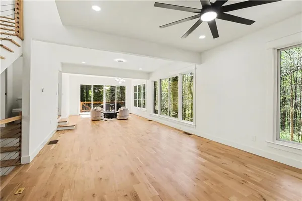 a view of an entryway with wooden floor