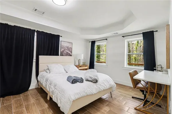 a bedroom with a bed and a table