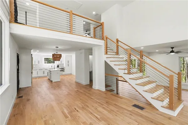 a view of kitchen with furniture and wooden floor