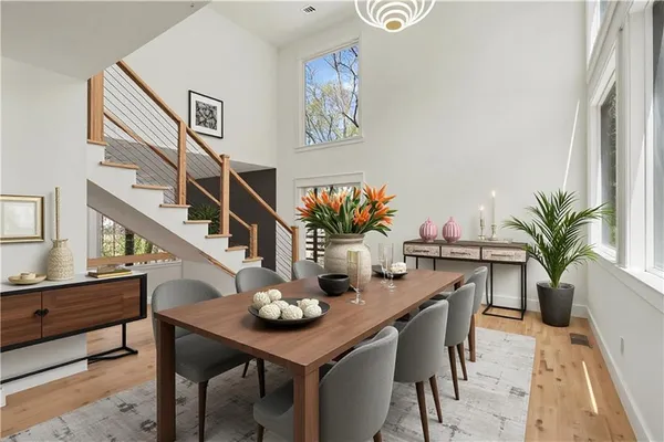 a view of a dining room with furniture and wooden floor