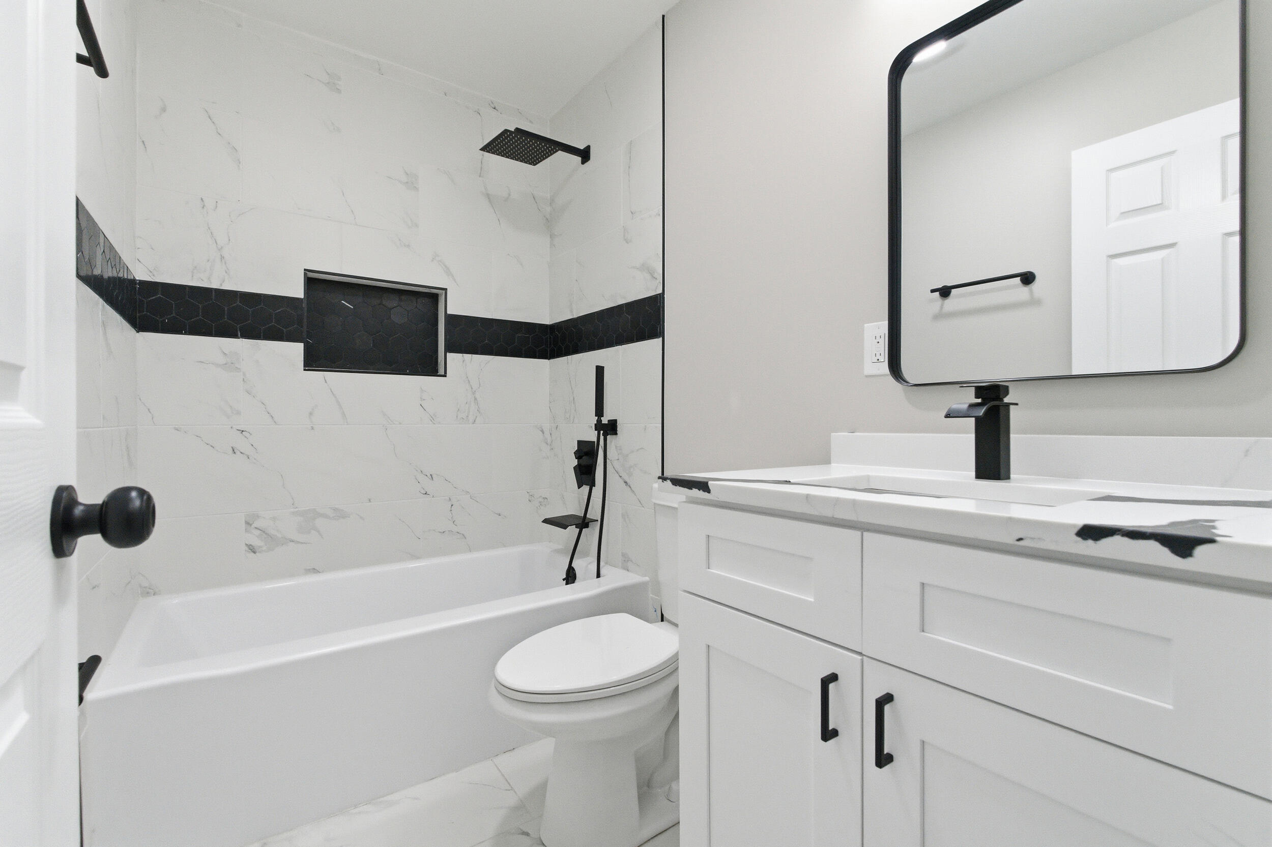 3610 175th Place Hammond, IN 46323 - Photo 15 of 21 a bathroom with a bathtub sink vanity mirror and toilet