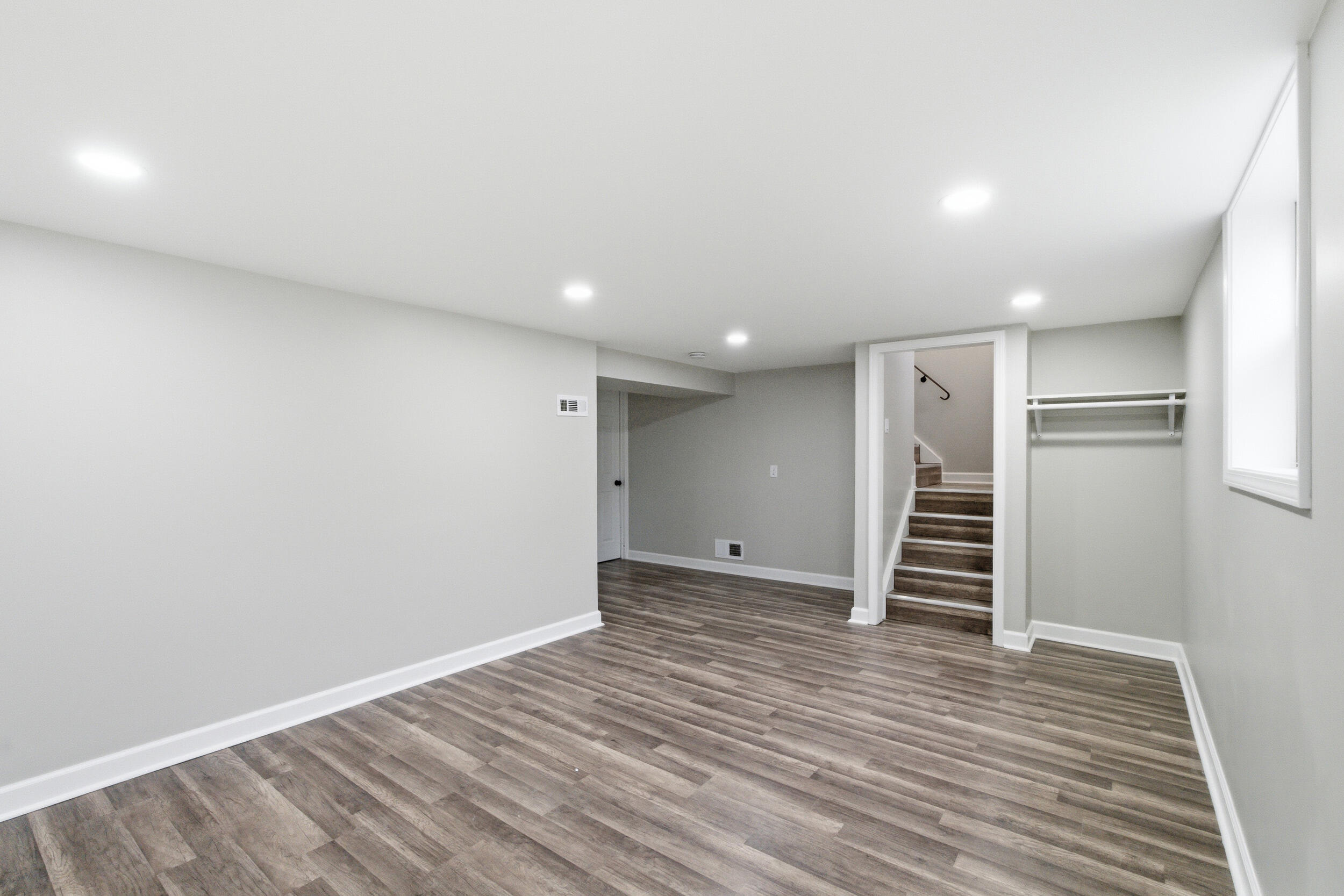 3610 175th Place Hammond, IN 46323 - Photo 17 of 21 a view of a livingroom with wooden floor and stairs