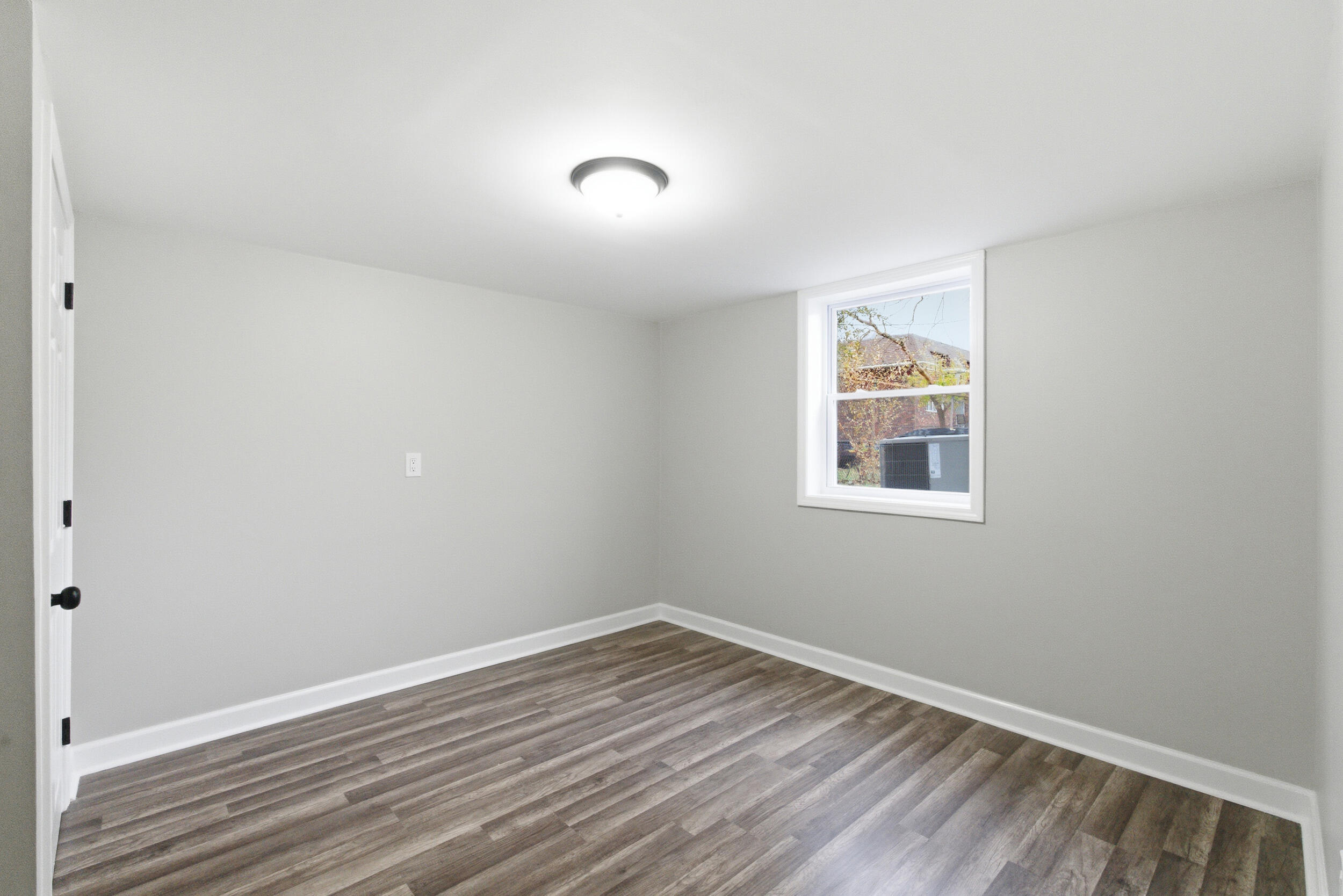 3610 175th Place Hammond, IN 46323 - Photo 19 of 21 a view of empty room with wooden floor and fan