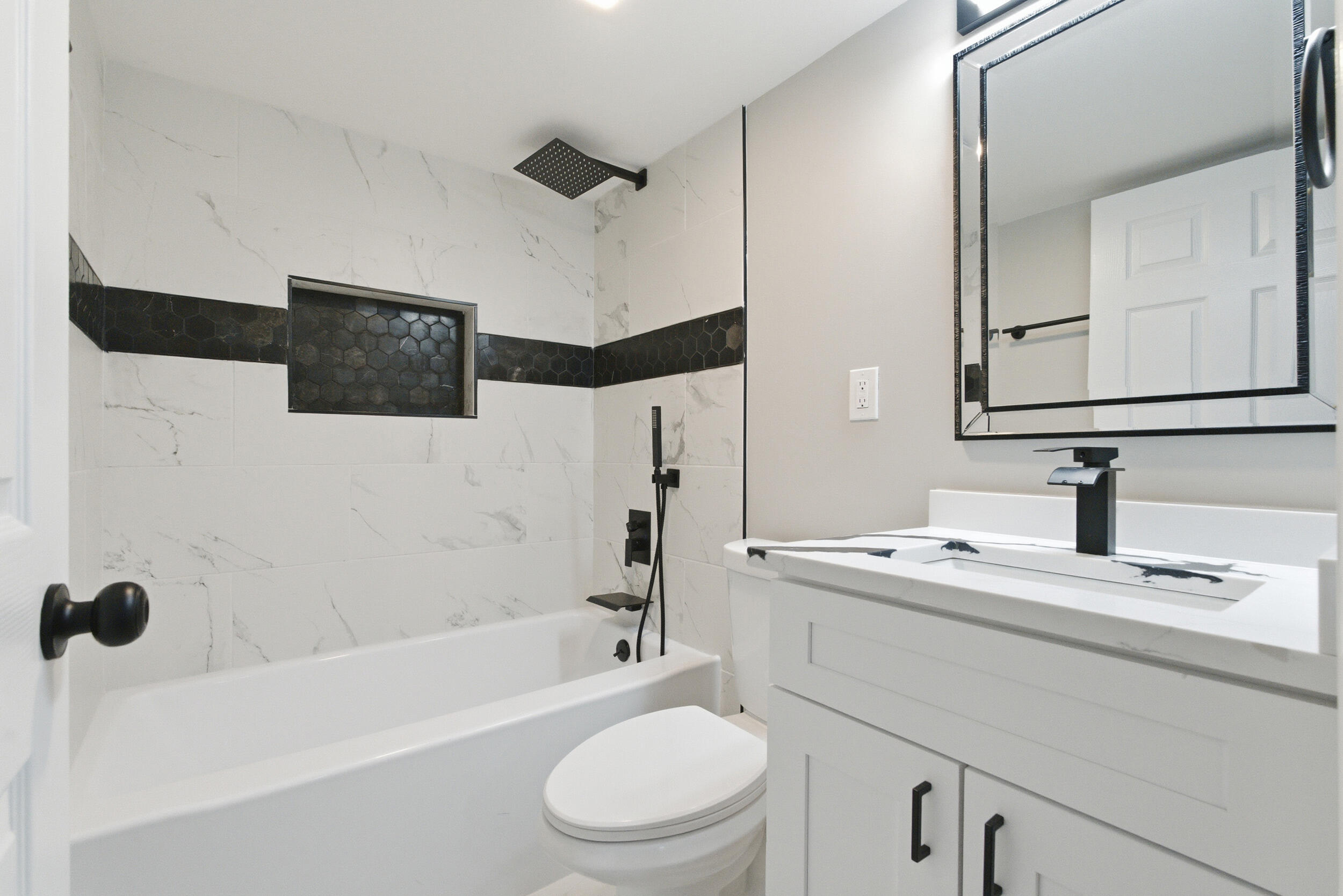 3610 175th Place Hammond, IN 46323 - Photo 10 of 21 a bathroom with a sink a toilet a mirror and shower