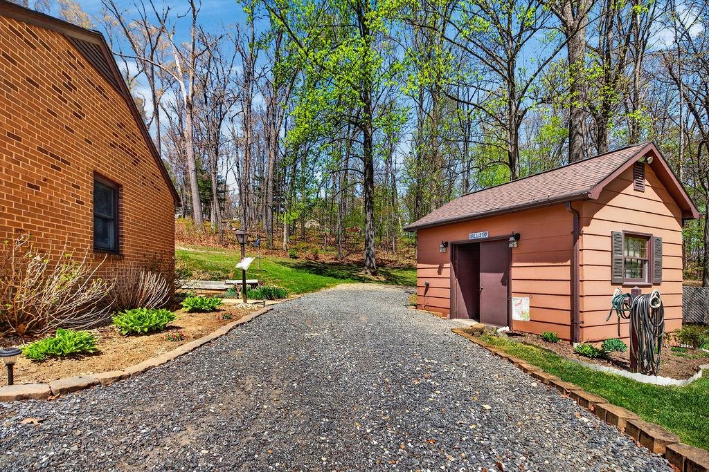 329 Red Hill Road Fairfield, VA 24435 - Photo 49 of 74 a backyard of a house with wooden fence and large trees