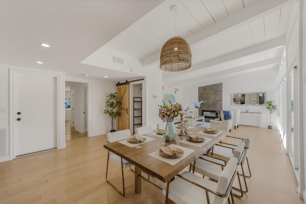 566 Maple Avenue Sunnyvale, CA 94085 - Photo 4 of 50 a view of a dining room with furniture and a chandelier