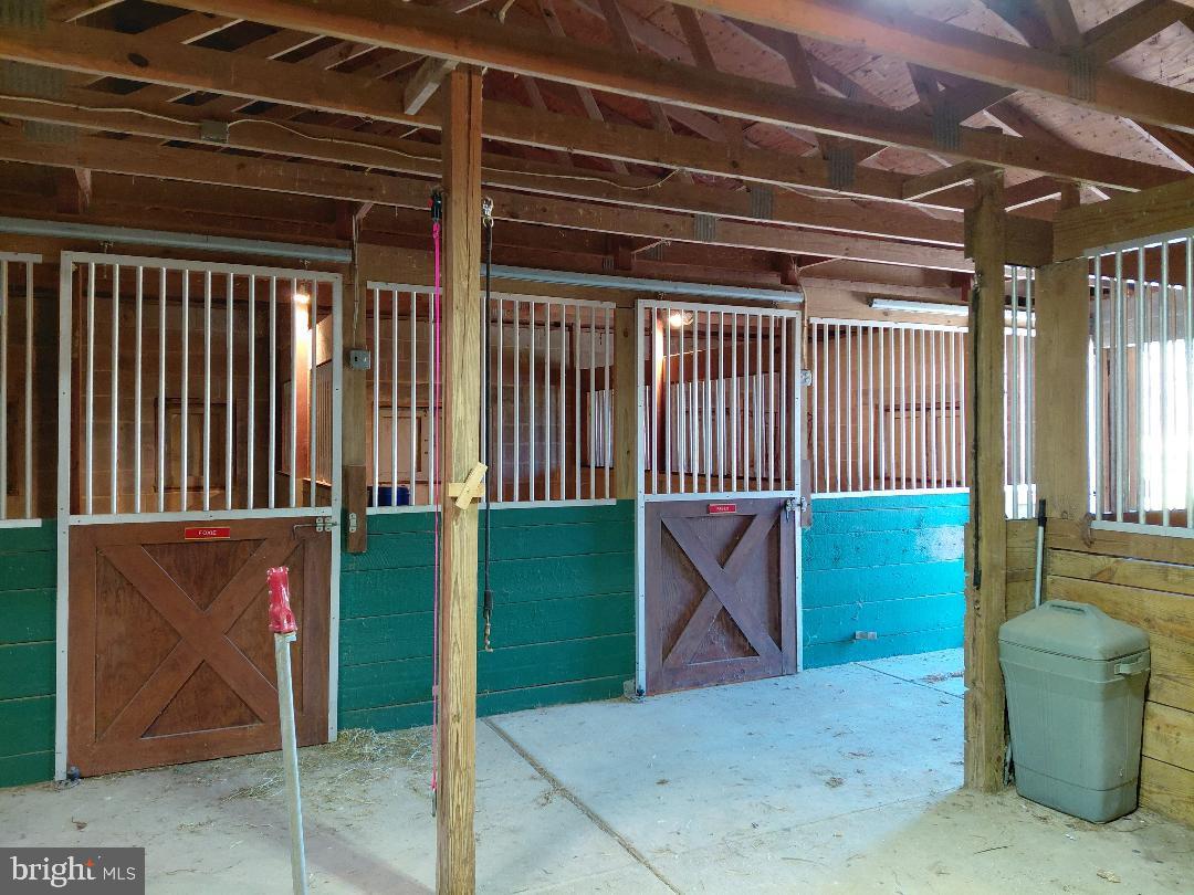 91 Stewart Road Pilesgrove, NJ 08098 - Photo 20 of 27 Spacious equestrian barn interior.