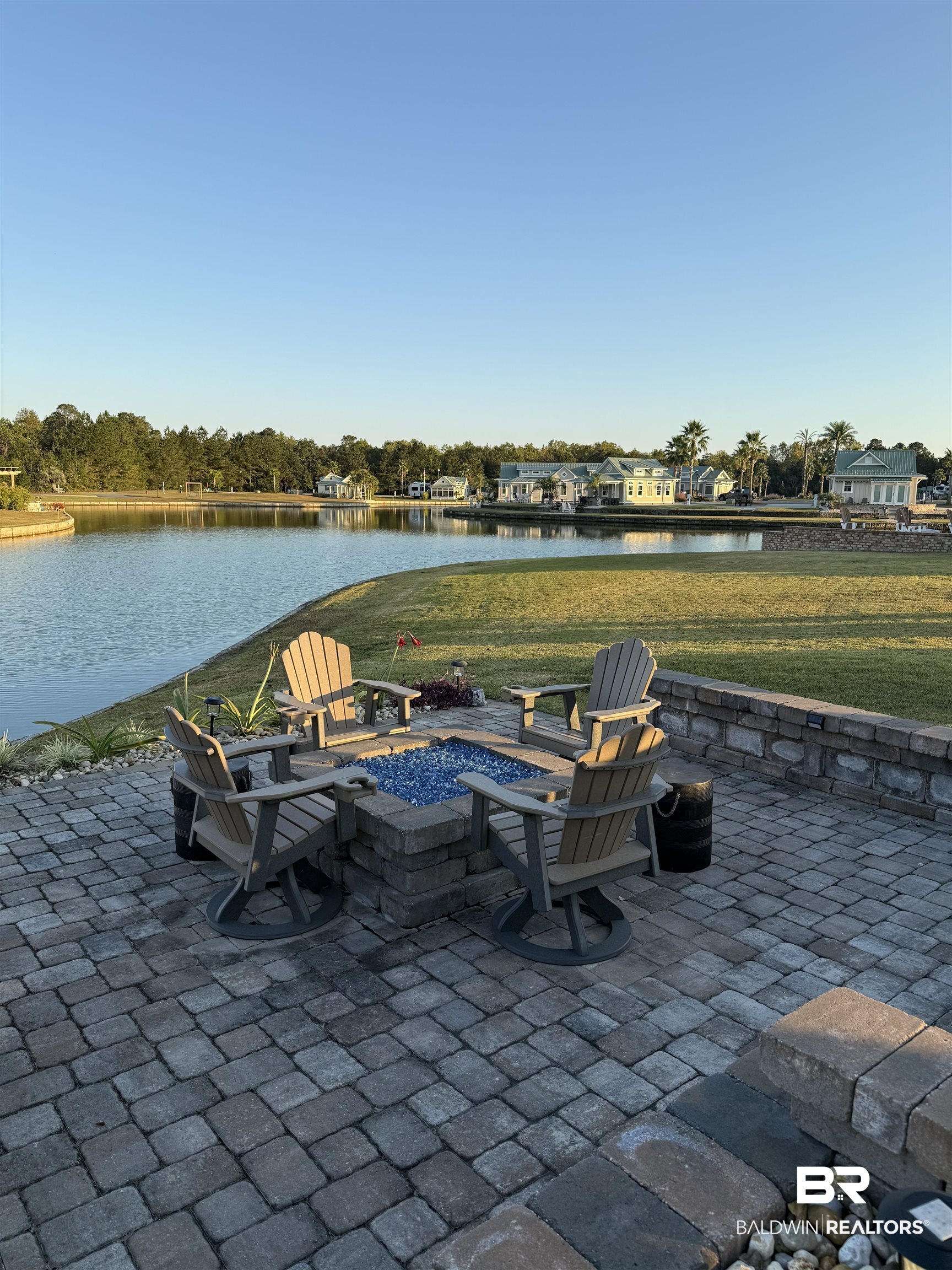 28238 Migratory Way Elberta, AL 36530 - Photo 20 of 58 View of patio / terrace with a water view and a fire pit