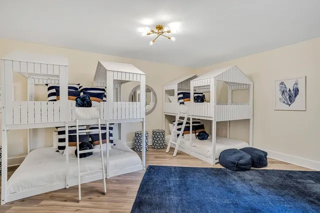 a living room with furniture a flat screen tv and a large window