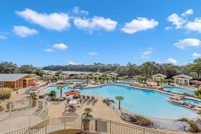 a view of a swimming pool with outdoor seating