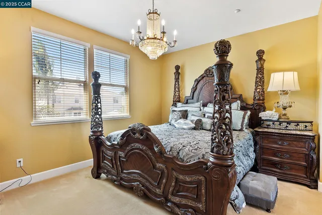 a bedroom with a bed and a mirror