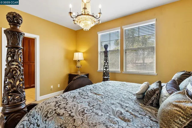 a spacious bathroom with a double vanity sink a mirror and a shower
