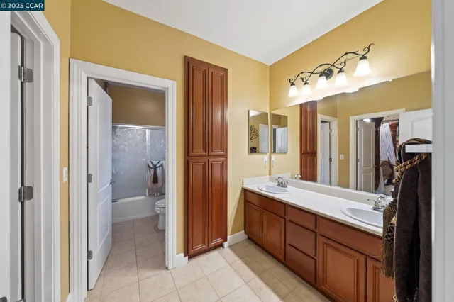 a front view of a house with yard and green space