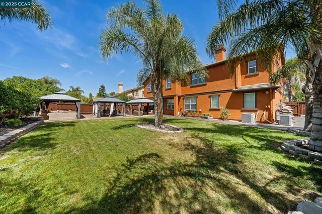 a view of a patio with table and chairs potted plants with wooden floor
