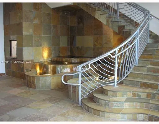 a view of entryway and kitchen