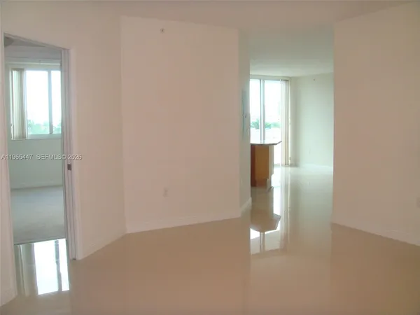 a view of an empty room and window