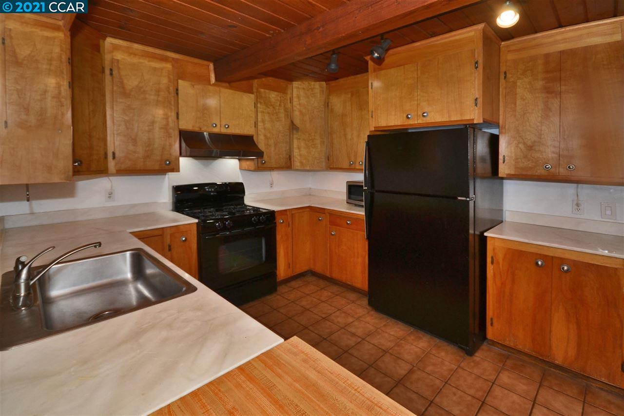 928 Janet Lane Lafayette, CA 94549 - Photo 14 of 35 a kitchen with a refrigerator sink and stove