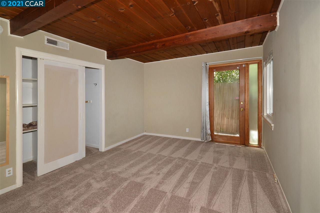 928 Janet Lane Lafayette, CA 94549 - Photo 16 of 35 a view of an empty room with wooden floor and a window