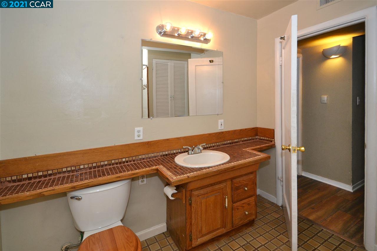 928 Janet Lane Lafayette, CA 94549 - Photo 17 of 35 a bathroom with a sink a mirror and a toilet