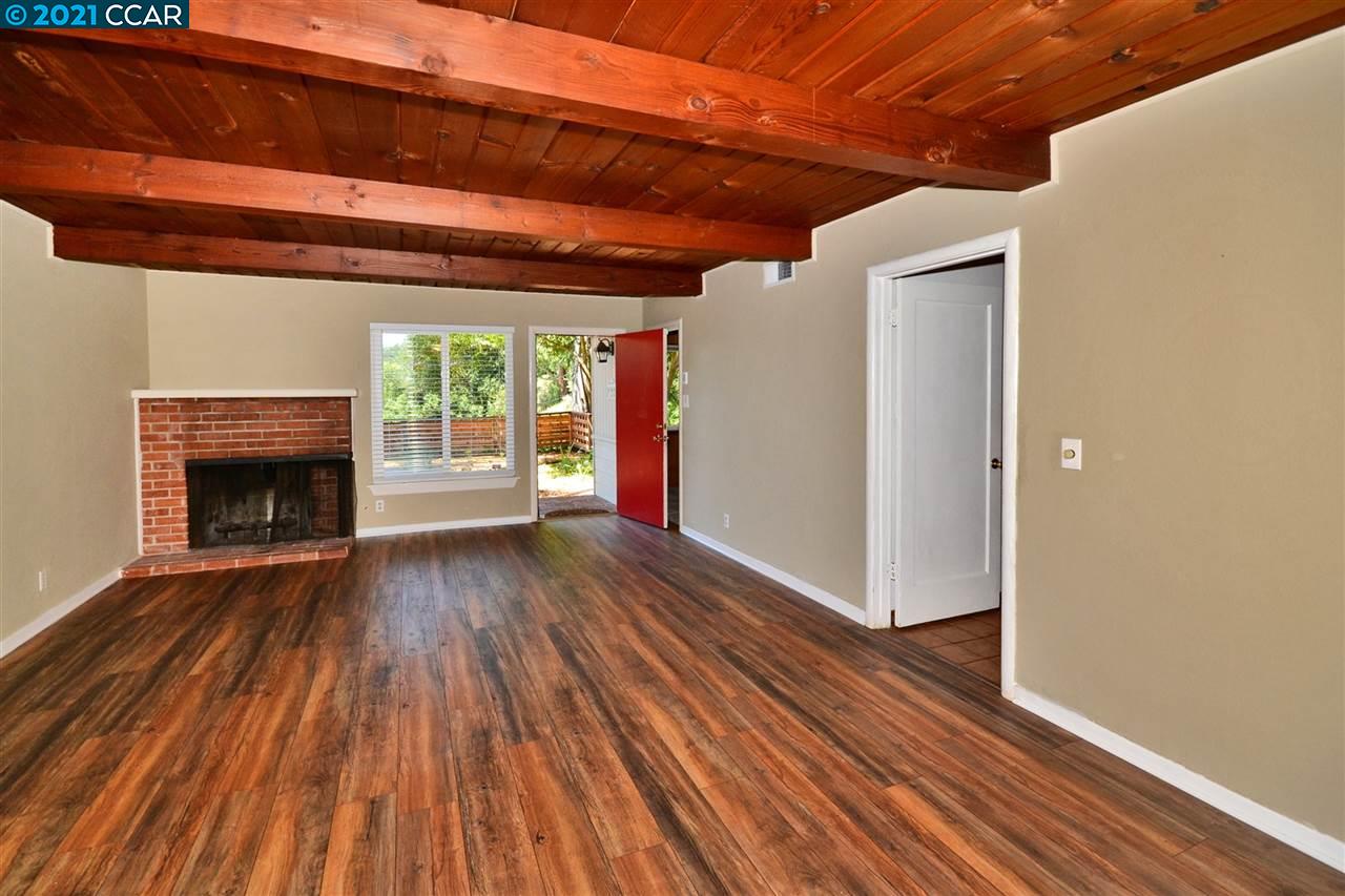 928 Janet Lane Lafayette, CA 94549 - Photo 8 of 35 a view of empty room with wooden floor and fireplace