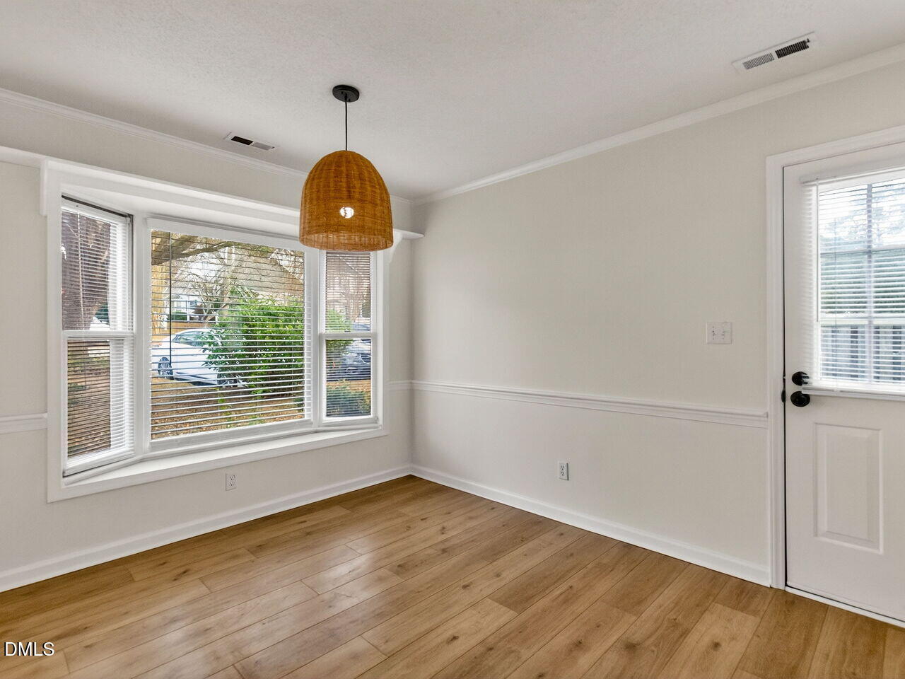 113 Towne View Trail Garner, NC 27529 - Photo 13 of 30 wooden floor in an empty room with a window
