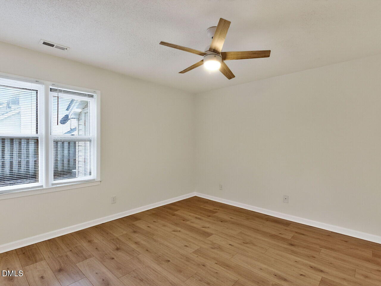 113 Towne View Trail Garner, NC 27529 - Photo 15 of 30 a view of empty room with wooden floor and fan