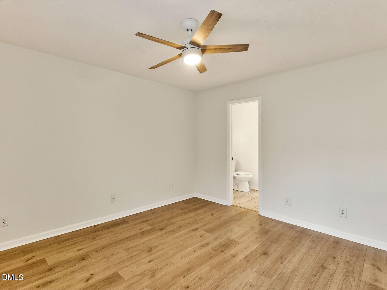 113 Towne View Trail Garner, NC 27529 - Photo 16 of 30 an empty room with wooden floor and windows