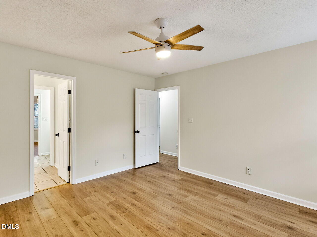 113 Towne View Trail Garner, NC 27529 - Photo 17 of 30 a view of a livingroom with a ceiling fan and wooden floor