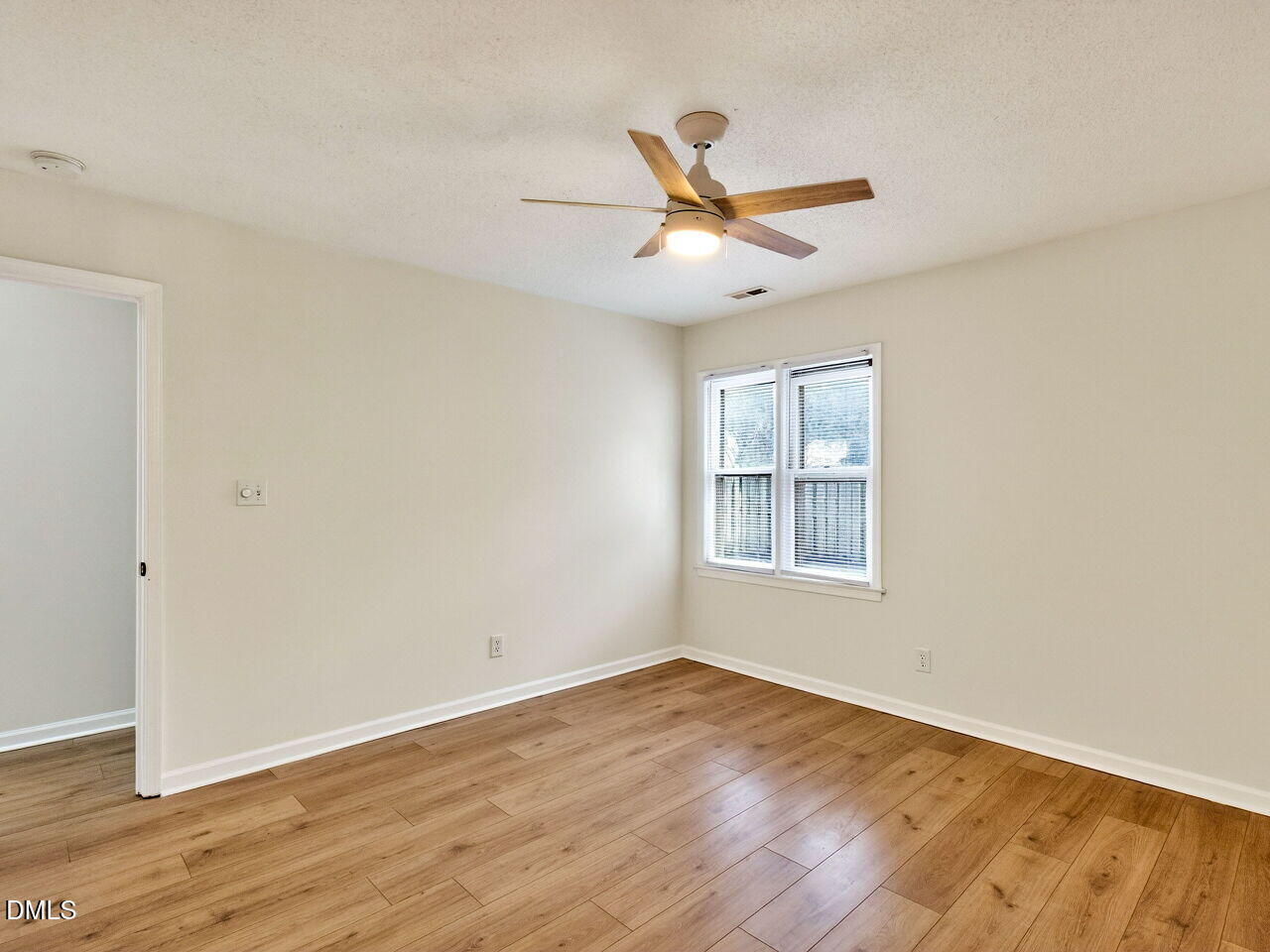 113 Towne View Trail Garner, NC 27529 - Photo 18 of 30 a view of empty room with wooden floor and fan