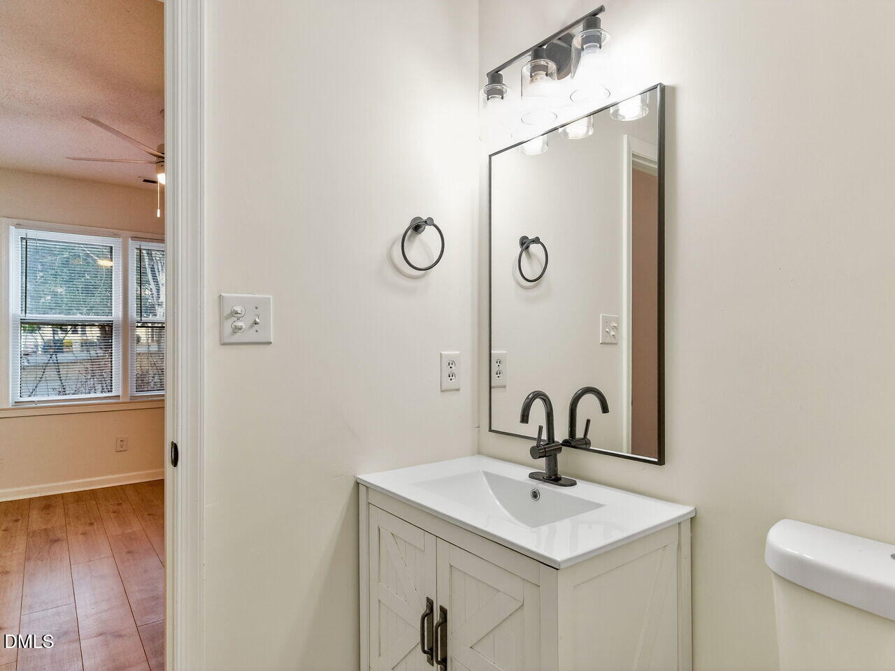 113 Towne View Trail Garner, NC 27529 - Photo 20 of 30 a bathroom with a sink and mirror with toilet