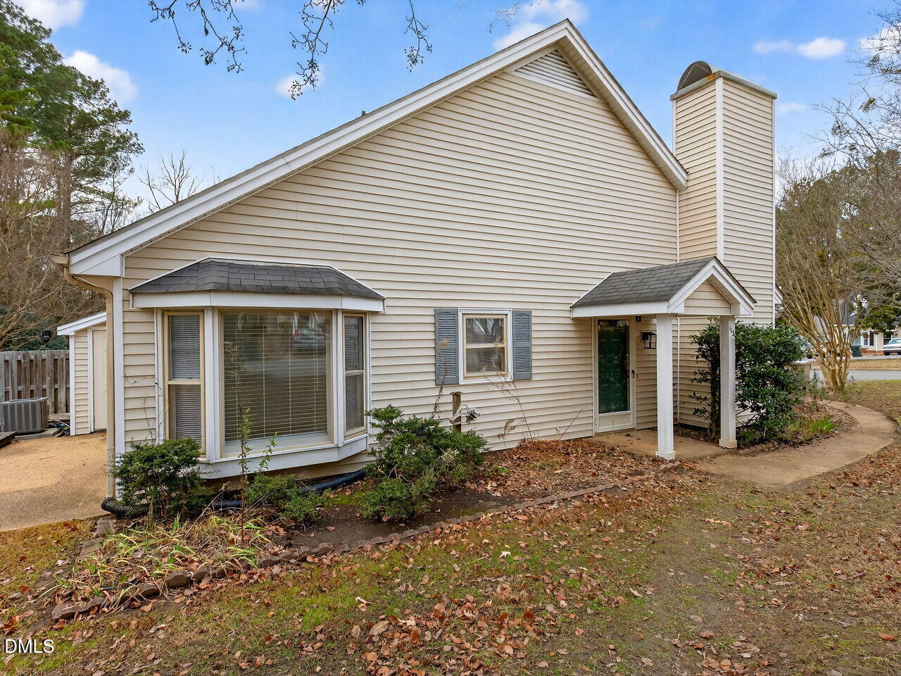 113 Towne View Trail Garner, NC 27529 - Photo 2 of 30 a view of a house with a yard and lawn chairs under an umbrella