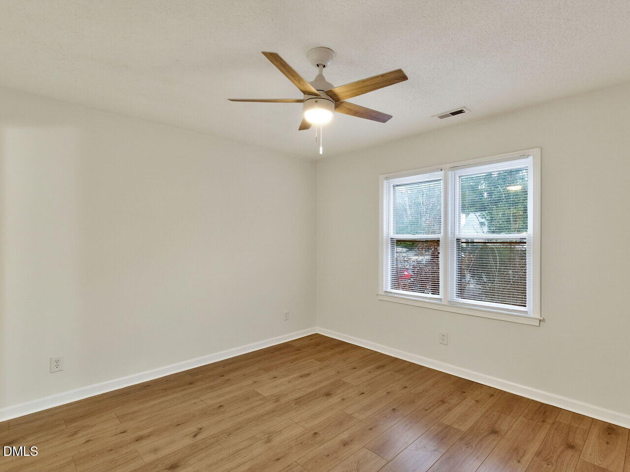 113 Towne View Trail Garner, NC 27529 - Photo 27 of 30 a view of an empty room with wooden floor and a window