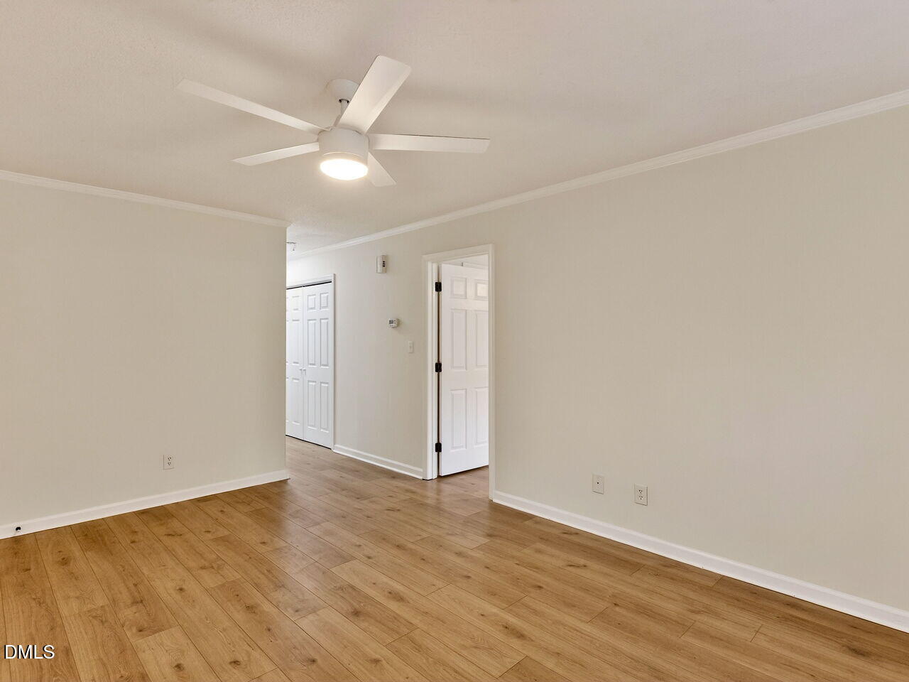 113 Towne View Trail Garner, NC 27529 - Photo 7 of 30 an empty room with wooden floor and windows