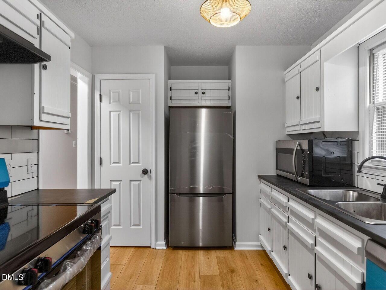 113 Towne View Trail Garner, NC 27529 - Photo 9 of 30 a kitchen with stainless steel appliances a refrigerator stove and sink