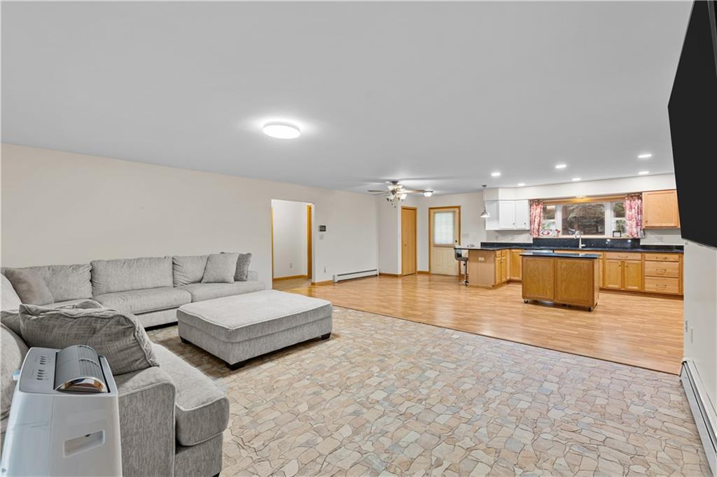 178 Christopher Road Flinton, PA 16640 - Photo 17 of 41 a living room with couches and kitchen view with wooden floor