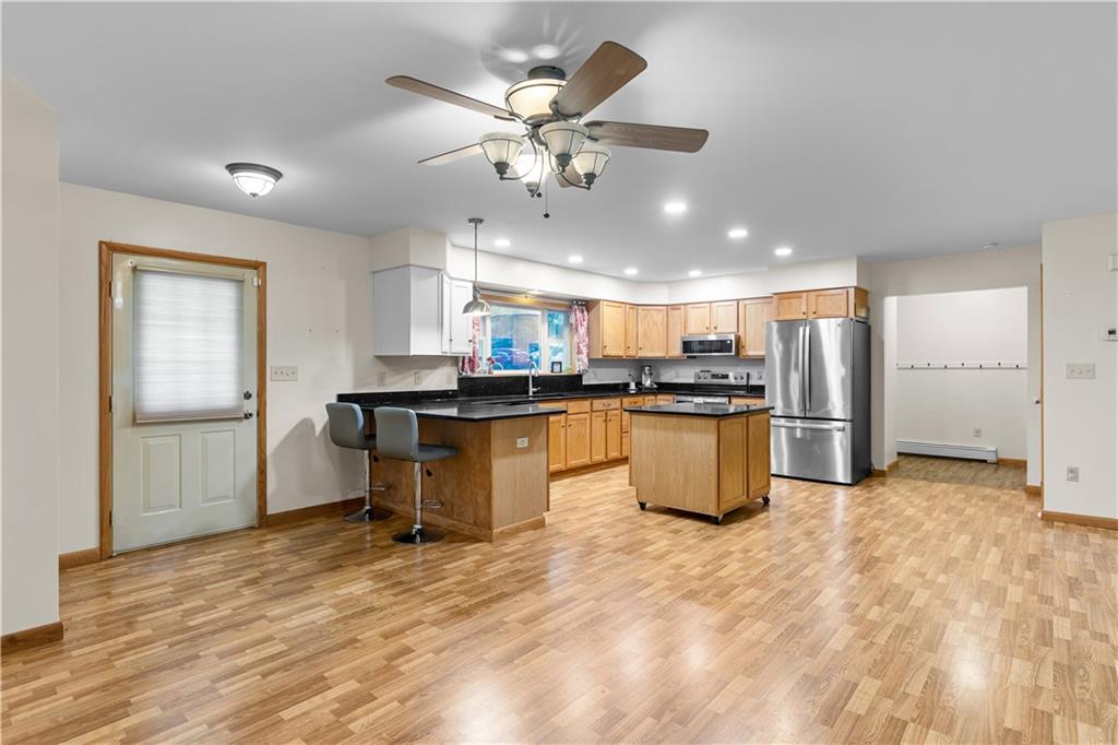178 Christopher Road Flinton, PA 16640 - Photo 8 of 41 a kitchen with stainless steel appliances kitchen island granite countertop a sink and a refrigerator