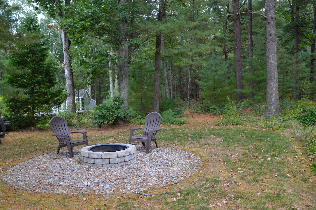 1379 Hope Road Cranston, RI 02831 - Photo 2 of 28 Back yard fire pit with trails to Curran State Park